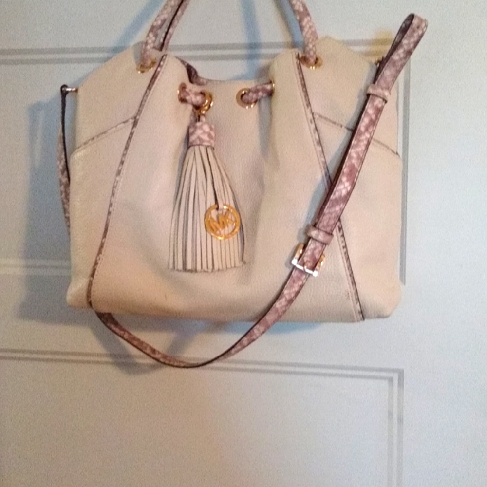 Michael Kors winter white with tan snakeskin like trim.